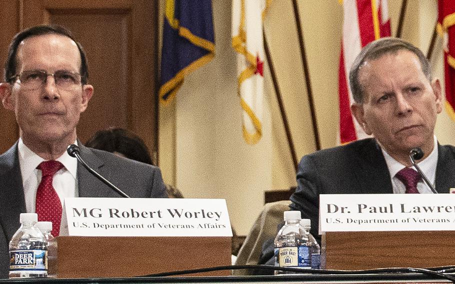 Retired Air Force Maj. Gen. Robert M. Worley II, director of education service for the Veterans Benefit Administration, and Paul R. Lawrence, the VBA's undersecretary for benefits, listen to opening statements during a House Veterans' Affairs subcommittee hearing on delays in GI Bill payments, Nov. 15, 2018 on Capitol Hill.