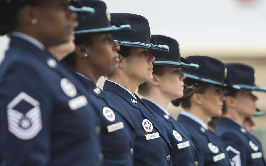 Military training Instructors with the 737th Training Group march in a all-female group during a basic military training graduation March 9, 2018 at Joint Base San Antonio-Lackland, Texas.