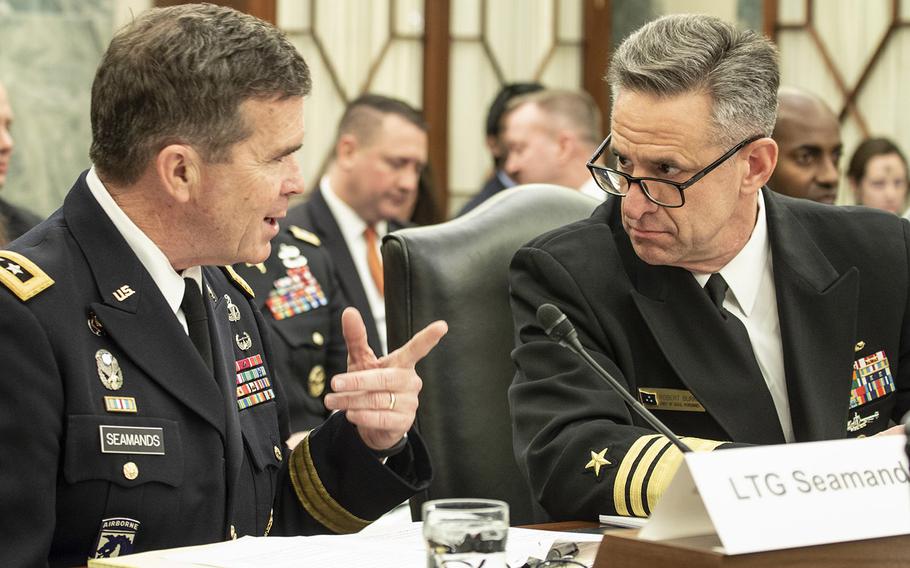 At a Senate Armed Services Committee hearing on Wednesday, personnel chiefs Lt. Gen. Thomas C. Seamands, left, and Vice Adm. Robert P. Burke, shown here in a 2018 photo, cited leadership issues as a factor in problems with base housing.