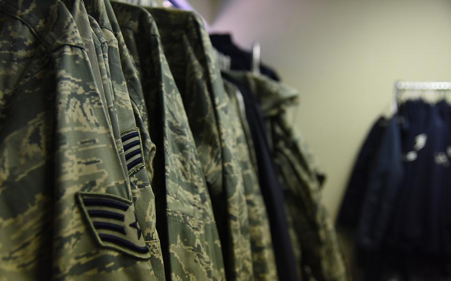 Airmen Battle Uniforms hang on a rack Feb. 8, 2018, at Altus Air Force Base, Okla. 
