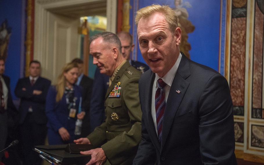 Acting Defense Secretary Patrick Shanahan arrives for the start of a Senate Appropriations subcommittee hearing on Capitol Hill in Washington on Wednesday, May 8, 2019. Behind Shanahan is Chairman of the Joint Chiefs of Gen. Joseph Dunford.