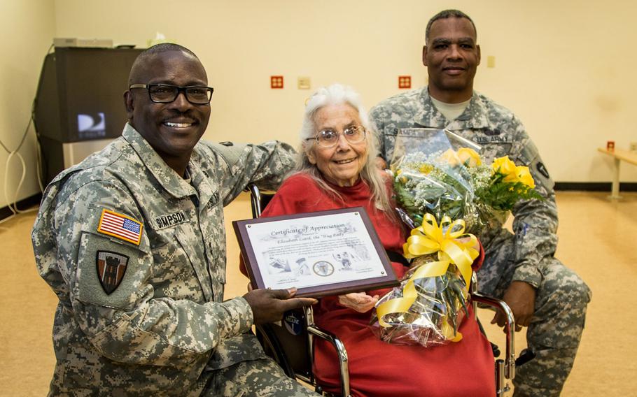 Maj. Gen. Lester Simpson, left, Elizabeth Laird, center, and Command Sgt. Maj. John Sampa at Fort Hood's Robert Gray Army Airfield on Sept. 13, 2015. Laird, who passed away in 2015, was recognized for her service to deploying soldiers with a plaque and a dozen yellow roses. 
