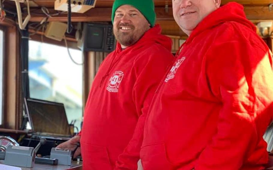 Navy veterans Erich Totsch, left, and Ray Novak inside the “Fred A. Busse” fireboat in May. The duo moved the boat from Sturgeon Bay, Wisc., back to its original home in Chicago, where they plan to use it for tours along the Chicago River.