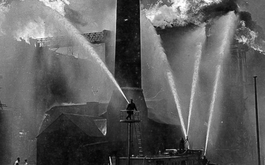 The “Fred A. Busse,” a Chicago fireboat, helps extinguish a fire at a grain elevator along the Chicago River in 1939. Two Navy veterans who purchased the boat in May plan to use it for commercial tours.