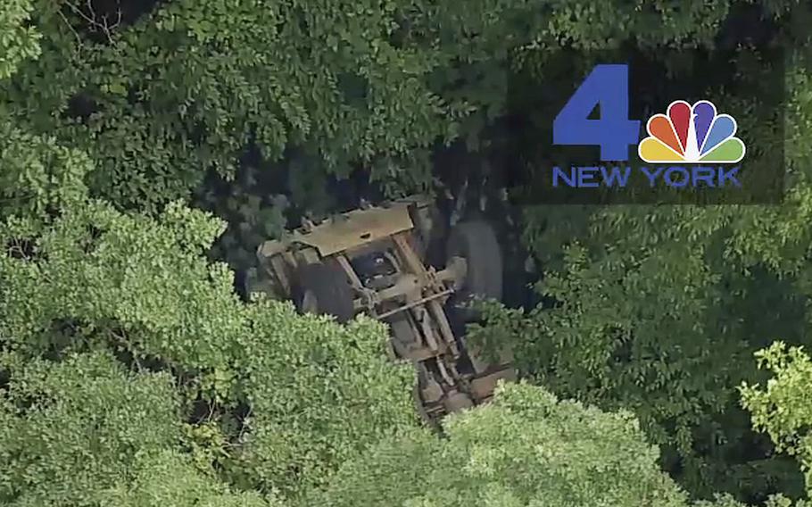 A video screen grab shows a light medium tactical vehicle overturned near the Camp Natural Bridge summer military training camp off Route 293, in Cornwall, N.Y., on Thursday, June 6, 2019 .
