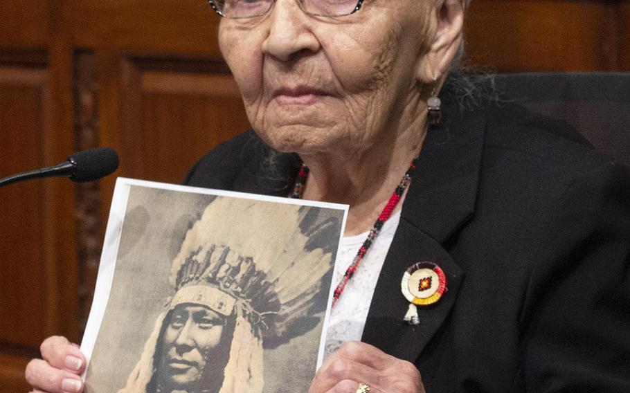Holding a picture of Rain In The Face, a relative who fought in the Little Bighorn battle, 99-year-old Marcella LeBeau speaks at a Capitol Hill press conference on the Remove the Stain Act on June 25, 2019. LeBeau, a member of the Cheyenne River Sioux Tribe, was a 1st lieutenant in the Army Nurse Corps during World War II. The bill would rescind the Medals of Honor awarded to soldiers involved in the 1890 Wounded Knee Massacre.
