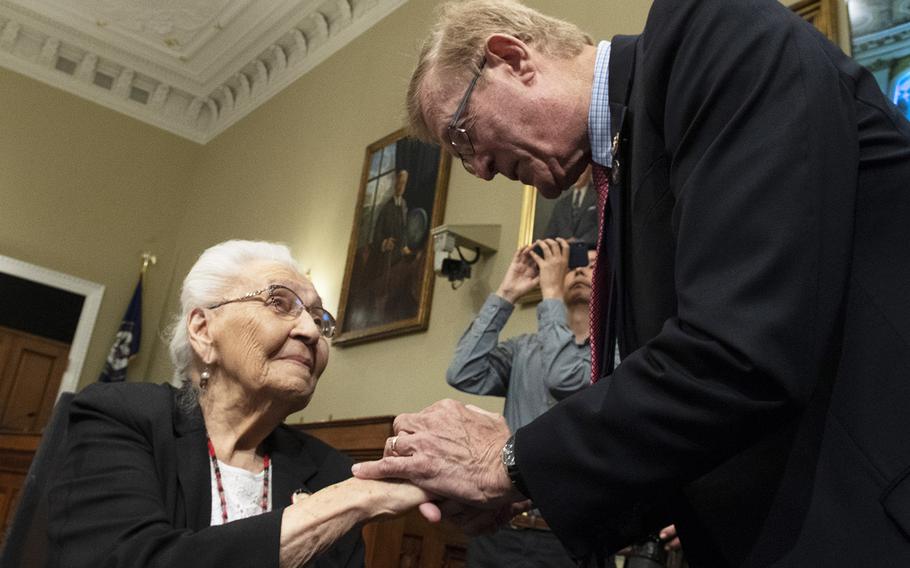 Rep. Paul Cook, R-Calif., talks with Marcella LeBeau before a Capitol Hill press conference on the Remove the Stain Act on June 25, 2019. The bill would rescind the Medals of Honor awarded to soldiers involved in the 1890 Wounded Knee Massacre.