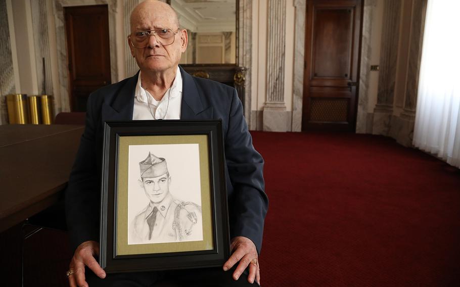 Clifton Sargent, holds a portrait of his brother Spc. 4 Donald Sargent, in a room at the Russell Senate Building March 15, 2019.  