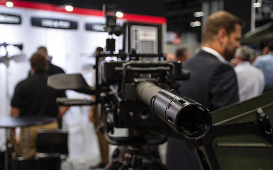 A Grenade Machine Gun stands among other small-arms weapons displayed at the annual AUSA convention in Washington, D.C., on Tuesday, Oct. 15, 2019. The automatic grenade launcher developed by Heckler & Koch has a cycle rate of 300 rounds per minute.