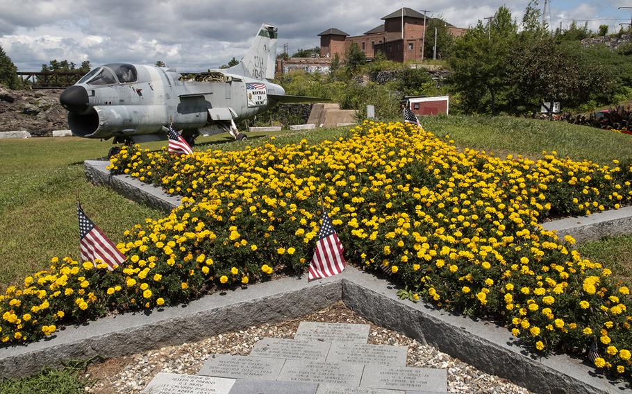 The Gold Star Mothers' floral monument at the Veterans Memorial Park in Lewiston, Maine, in August, 2019. In the background is an A-7D Corsair attack aircraft.