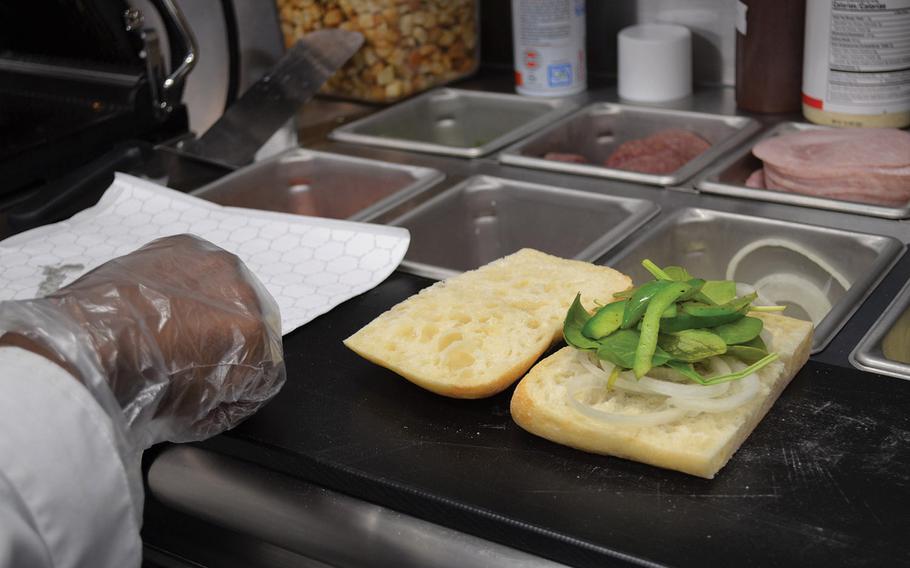 Paninis made to order with fresh ingredients are one of the menu options available at the Culinary Outpost food truck at Fort Hood, Texas. Soldiers can also choose from burgers, burritos and salads. 