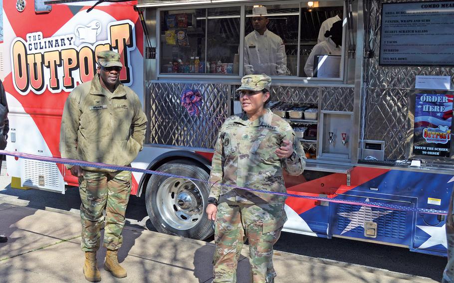 Sgt. Maj. Sylvia Thomas, III Corps chief culinary management sergeant major, welcomes customers to Fort Hood's Culinary Outpost food truck Feb. 6, 2020. The Army has six trucks at five bases to get meals to soldiers working in locations on base that are not close to a dining facility. 