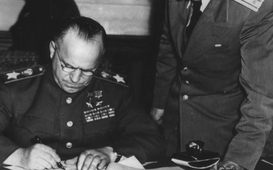 Marshal Georgi Konstantinovich Zhukov, deputy commander-in-chief of the Soviet forces, signs the formal unconditional surrender by German forces on May 9, 1945. The event took place two days after a document was signed by German officials in Reims, France, and announced the following day, May 8.






