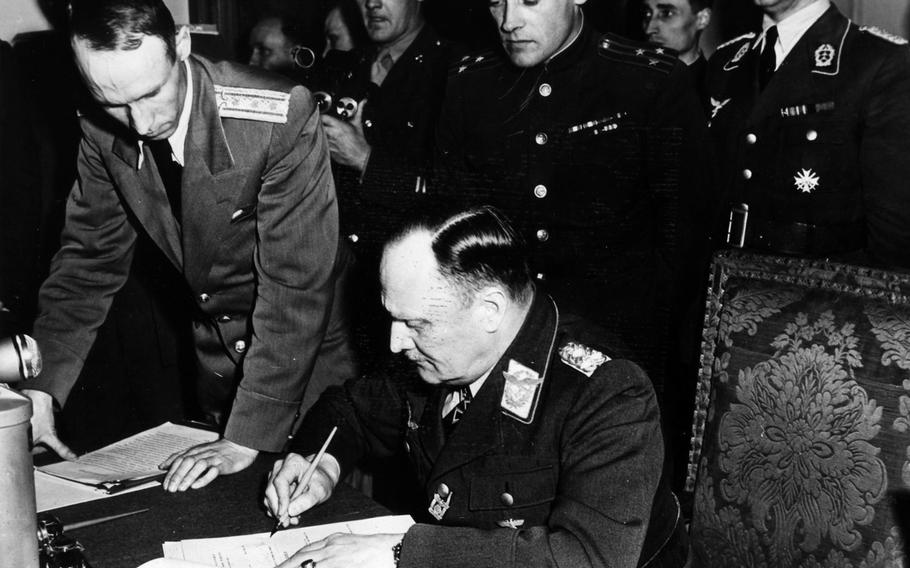 Col. Gen. Paul Stumpff signs the surrender terms for the Luftwaffe, Germany's air force, early May 9, 1945, in Berlin. The combined chiefs of the German army, navy and air force signed the formal ratification of the Third Reich's unconditional surrender in Berlin before Air Chief Marshal Sir Arthur Tedder, representing Gen. Dwight D. Eisenhower, commander of all Allied forces, and Marshal Georgi Konstantinovich Zhukov, deputy commmander-in-chief of the Soviet Forces. The event took place two days after a document was signed by German officials in Reims, France, and announced the following day, May 8.






