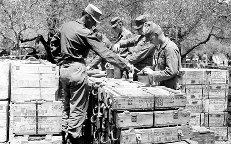 Sfc. Albert Clark supervises an ammunition check.