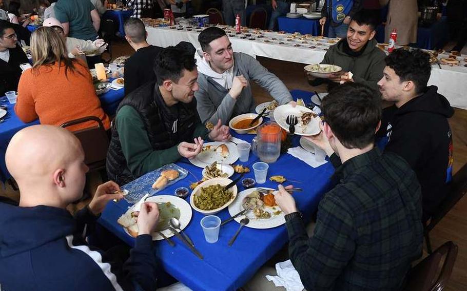 Seamen from the Naval Submarine Base New London eat their Thanksgiving dinner Thursday, Nov. 25, 2021, at the Submarine Veterans Club in Groton, Conn. 