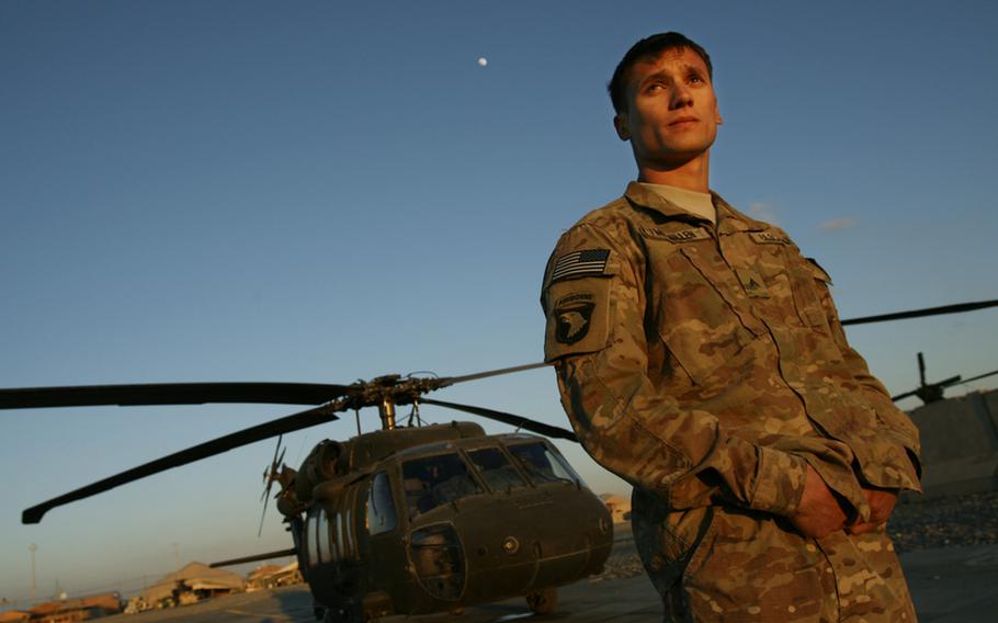 Sgt. Jon McMillen, a Pathfinder with Company F, 4th Battalion, 101st Aviation Regiment, 159th Combat Aviation Brigade, 101st Airborne Division, pauses near his home on Mustang Ramp on Jan. 4, 2012, at Kandahar Air Field, Afghanistan.