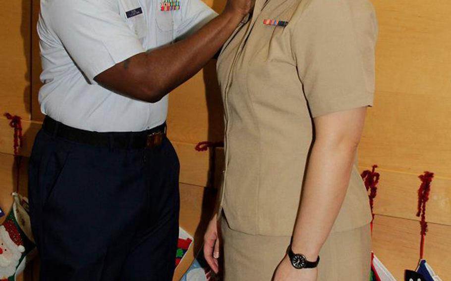 Walt Daniel, now a retired Coast Guard officer, pins the Navy lieutenant junior grade rank on his wife, Rebekah Daniel during her promotion ceremony in 2012. The picture was taken on the labor and delivery floor of Naval Hospital Bremerton in Washington, where she worked as a nurse and where she died in childbirth in March 2014.