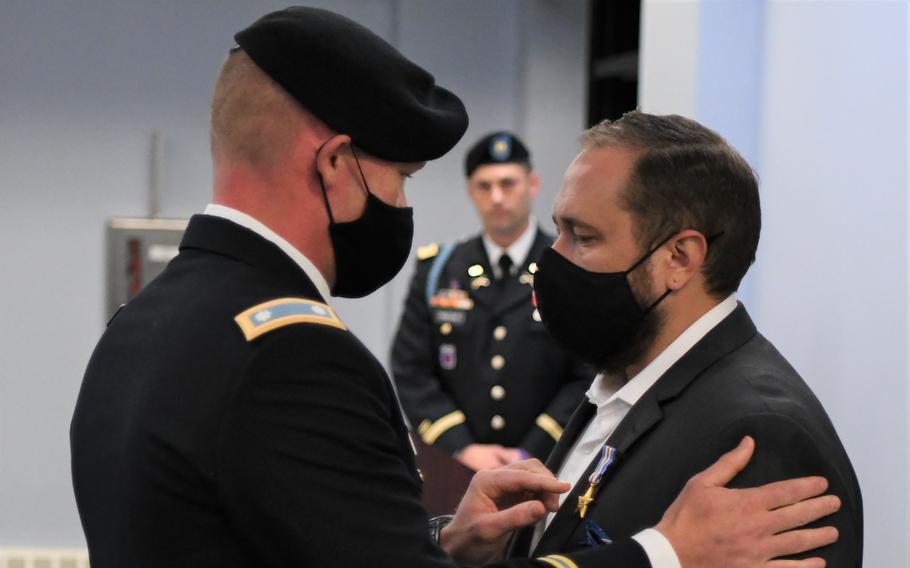 Retired Sgt. Adam Holroyd, right, assigned to 1st Battalion, 32nd Infantry Regiment, 3rd Brigade Combat Team, was awarded the Silver Star during a ceremony Sept. 1 at Fort Drum. 