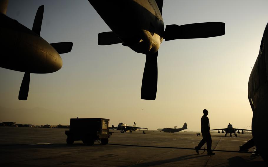 An airman from the 774th Expeditionary Airlift Squadron, boards a C-130H Hercules after completing pre-flight checks at Bagram Air Field, Afghanistan, Jan. 4, 2011. 