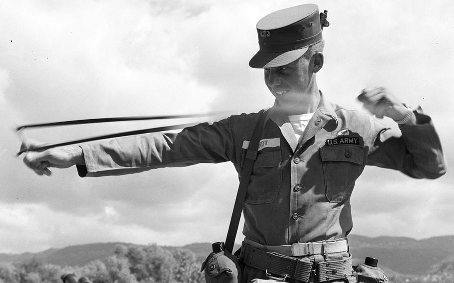 Sp4 David O. Quandt of Battery A, 13th Artillery, unleashes a round from his slingshot during Operation Blue Bat in Lebanon in September, 1958.