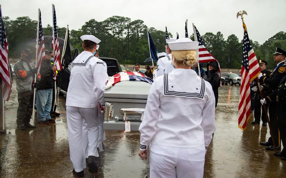 William Eugene Blanchard’s casket is carried to a hearse at Norfolk International Airport on Thursday, June 3, 2021, in Norfolk, Va. The sailor from Tignall, Georgia, died aboard the battleship USS Oklahoma when it was torpedoed in Pearl Harbor in 1941. 