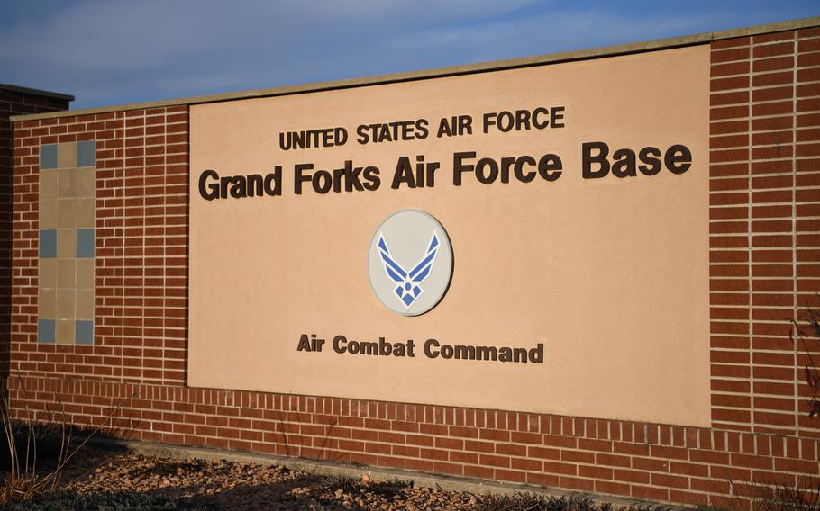 An installation sign is displayed at the main gate of Grand Forks Air Force Base, N.D., Oct. 31, 2019. Last year, North Dakota lawmakers raised alarm when a Chinese conglomerate bought agricultural land near Grand Forks Air Force Base with hopes of building a corn mill.