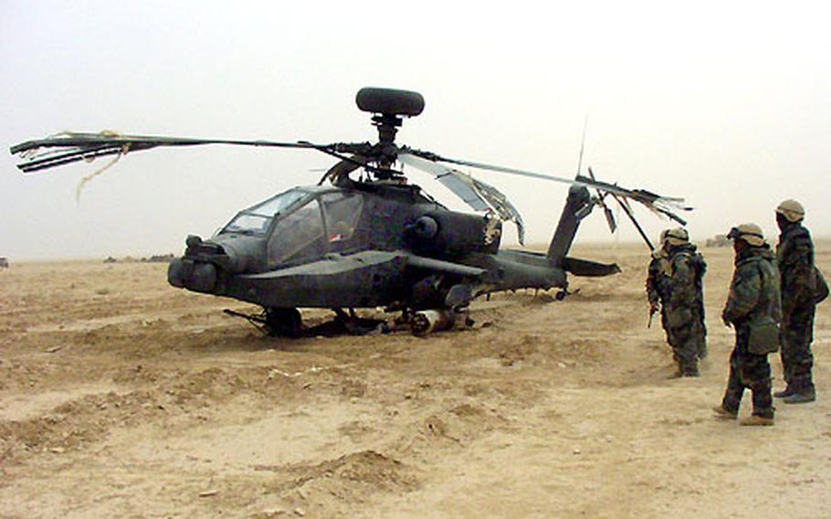 This Apache Longbow from the 6th Squadron, 6th Cavalry Regiment, was badly damaged in a hard landing before Sunday night&#39;s raid near Baghdad.