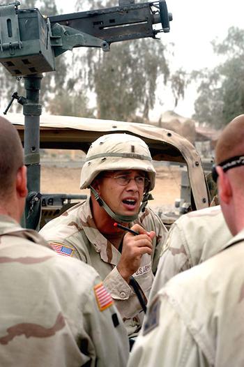 1st Lt. Greg Hotaling, leader of the supply platoon for Headquarters, Headquarters Company, 1st Battalion, 8th Infantry Regiment at LSA Anaconda, Iraq, briefs his troops before a supply mission Friday. The soldiers have come under fire often. The platoon’s troops have been wounded trying to keep others soldiers supplied.