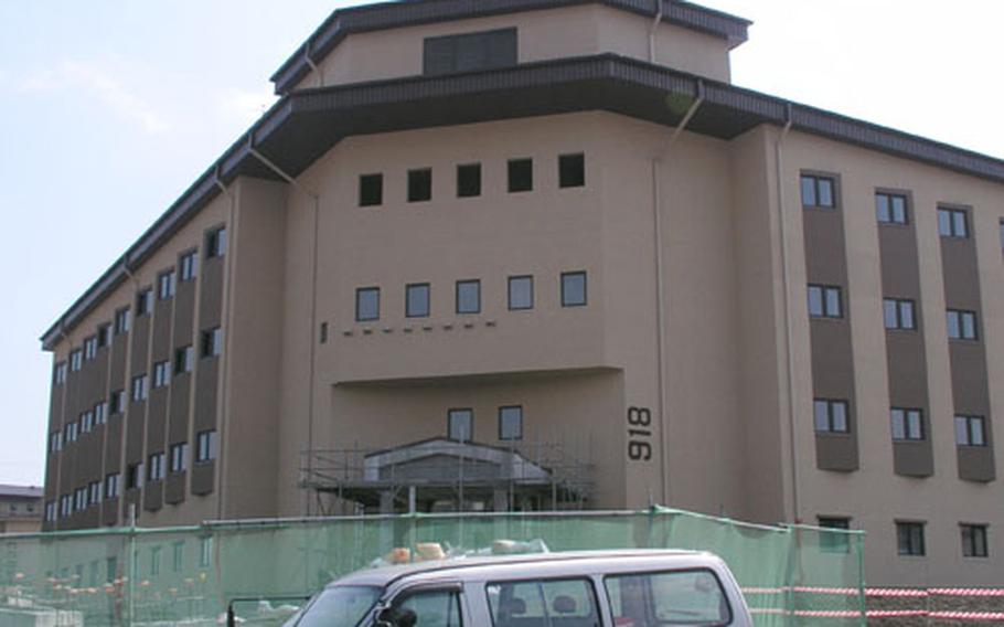 At Osan Air Base, South Korea, construction continues on this four-story officers&#39; dorm set to open this summer. The $8.6 million project includes the 69-room dorm, plus parking area and landscaping. Located 48 miles south of Korea&#39;s Demilitarized Zone, the base is home to the 51st Figher Wing, the most forward-based permanent wing in the U.S. Air Force.