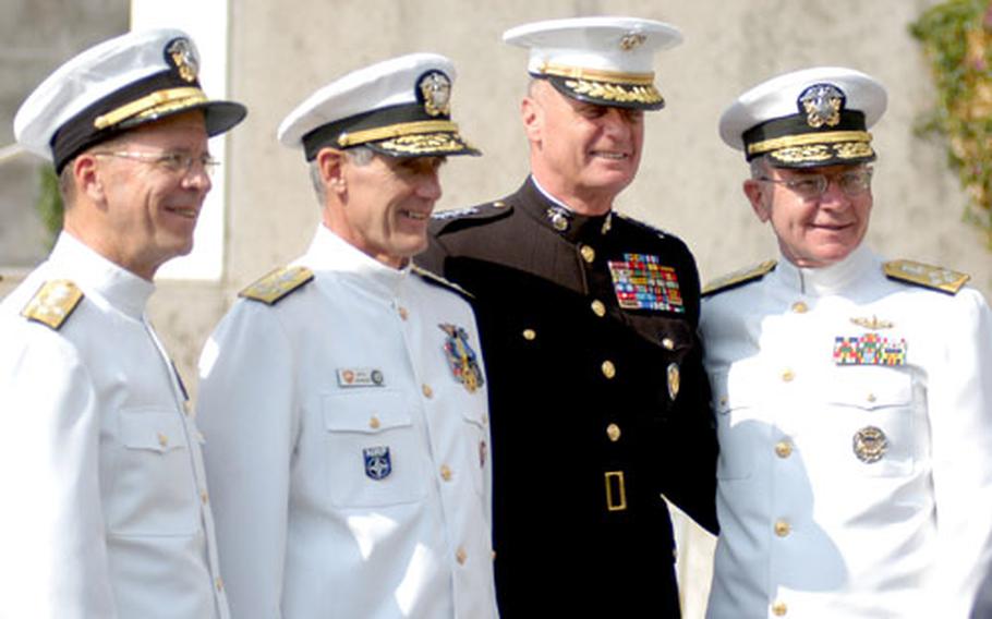 From left, then-Adm. Michael G. Mullen, then-Adm. Gregory G. Johnson, then-Marine Gen. James Jones and then-Chief of Naval Operations Adm. Vernon Clark pose for a photograph in Bagnoli, Italy, in 2004.