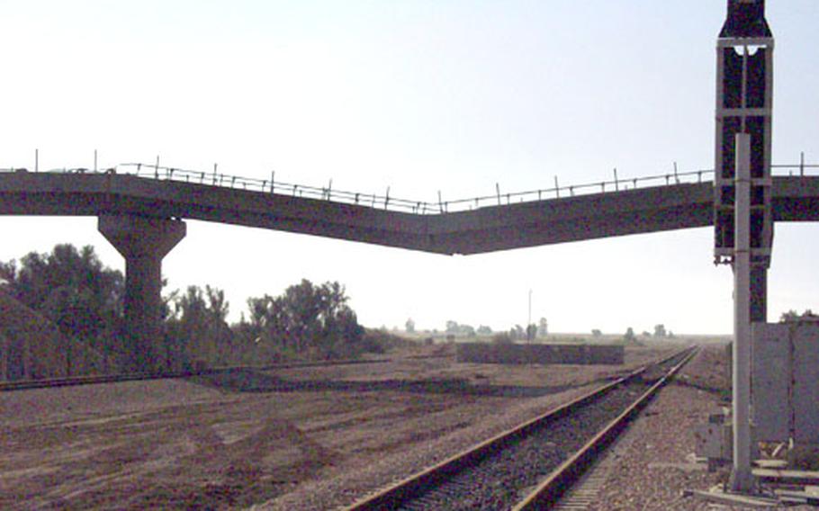 Insurgents blew up the center support for this highway bridge near Forward Operating Base Summerall on Nov. 13, 2004.