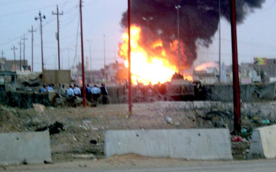 A fuel tanker burns in downtown Bayji during a firefight Nov. 9, 2004, between U.S. forces from the 1st Infantry Division’s Task Force 1-7 and Iraqi insurgents. A tank shot a rocket at the fuel tanker because rebels were using it as cover.