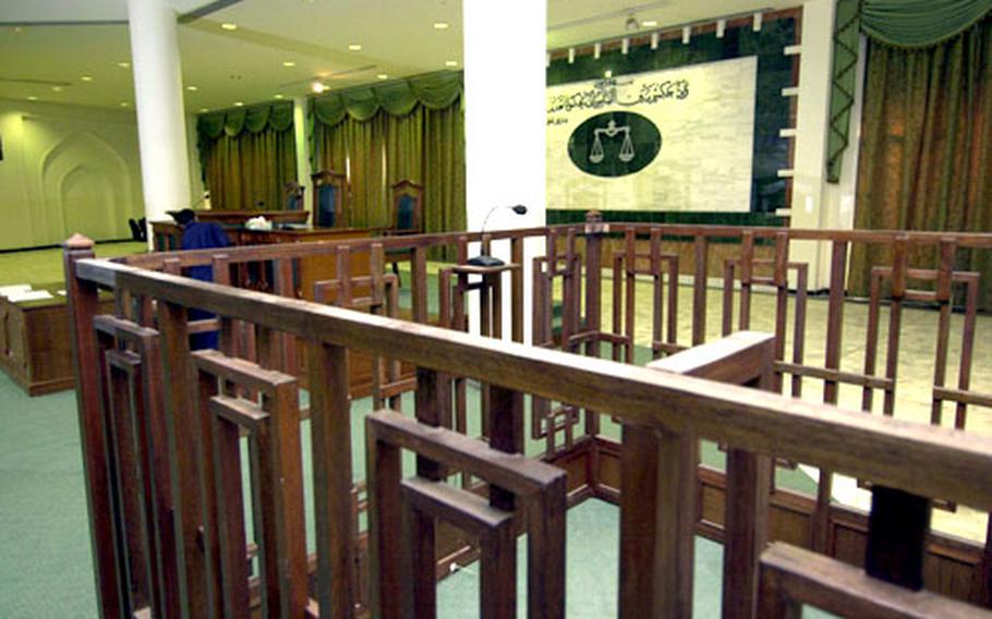 The court is seen from the point of view of the defendants&#39; dock in the main courtroom.