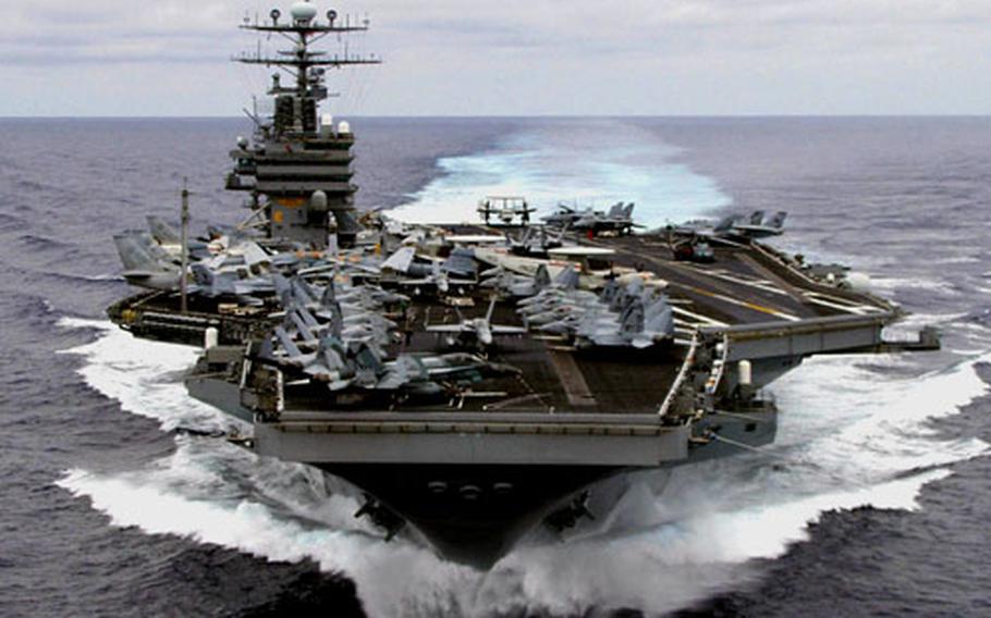 The USS Carl Vinson pulled into Guam's Apra Harbor for a scheduled port call on Feb. 24, 2005. Due to the effects of sequestration, the Navy said in 2013 that it is planning to cancel some training for the carrier strike group.