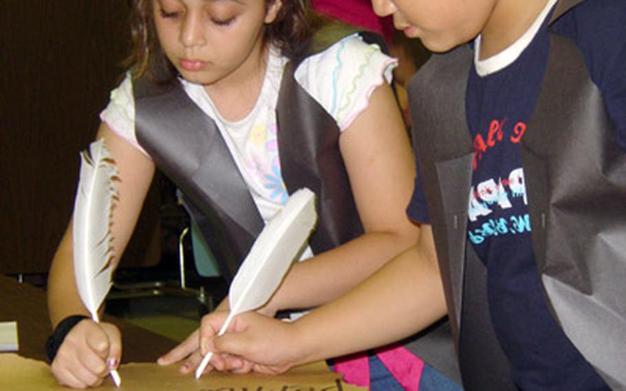 At Pusan American School in late 2005, students dressed in early American costume help write a constitution for their class. A variety of special events are in the works to mark the school’s closing this summer, said Principal Keith Henson.