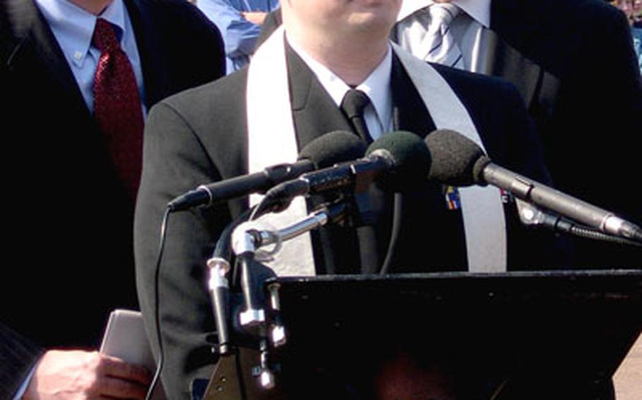 Navy Chaplain (Lt.) Gordon Klingenschmitt speaks at a protest outside the White House in March. With him are the Rev. Rob Schenck, left, president of the National Clergy Council, and Rick Scarborough, president of Vision America. Klingenschmitt is facing a court-martial for wearing his uniform during the protest.