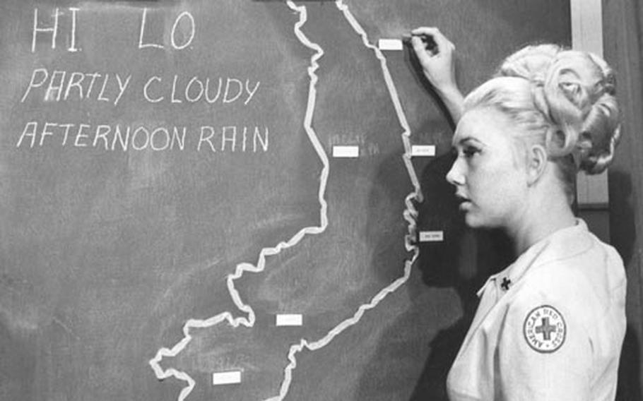 Barbara (Bobbie) Oberhansly delivers the weather forecast for Vietnam on Armed Forces Television in 1967.