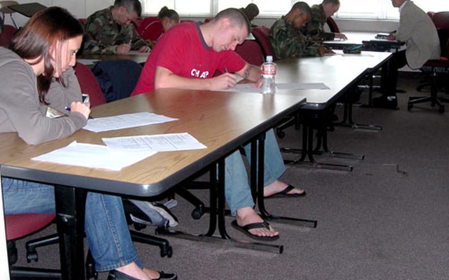 Servicemembers and civilians take a test in Moriaki Kanai’s Elementary Japanese class at the University of Maryland College at Yokota Air Base, Japan, September of 2006.