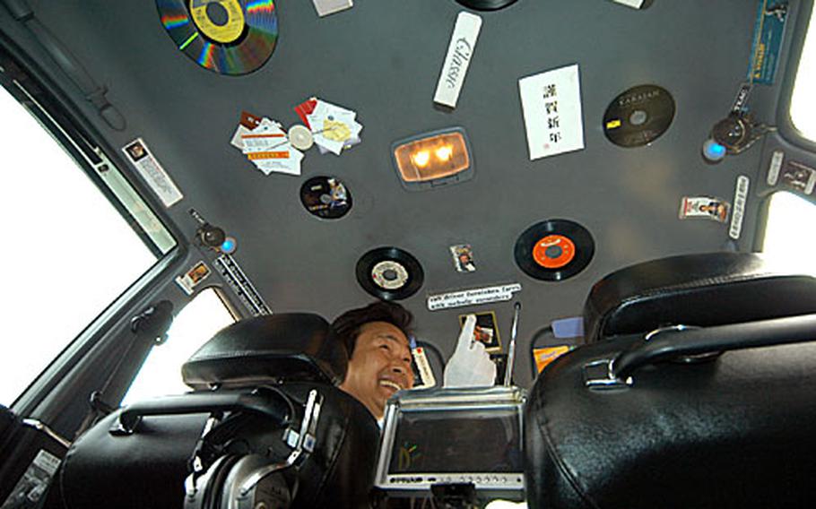 Cho Young-ho, a South Korean taxi driver in Seoul, shows off his custom taxi that he’s decked out with a state-of-the-art entertainment system.