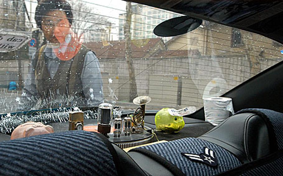 Young-ho, a South Korean taxi driver in Seoul, shows off his custom taxi.