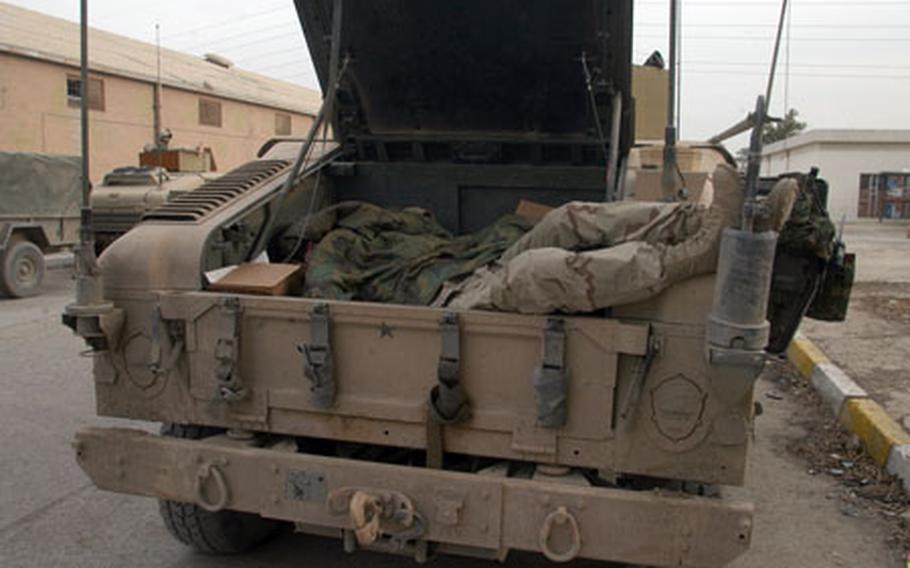Soldiers grab sleep when they can get it and where they can get it. A soldier from Company C, 4th Battalion, 31st Infantry Regiment, sleeps in the trunk of a Humvee. Soldiers throughout Iraq have had been conducting more and longer missions in preparation for the elections.