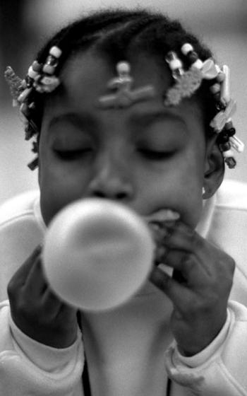 Nine-year-old Darshana McClain concentrates on a bubble.