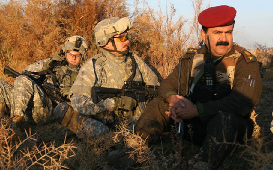 From right to left, Iraqi Lt. Col. Subhi Abdul-Karim Hassan, Capt. Michael Groom and 1st Lt. Jordan Pagones prepare to leave their ambush positions outside the village of Pir Ahmad, in northern Iraq. The ambush was meant to kill or capture four members of an insurgent cell who planted a bomb last month that killed two soldiers with Groom’s unit.