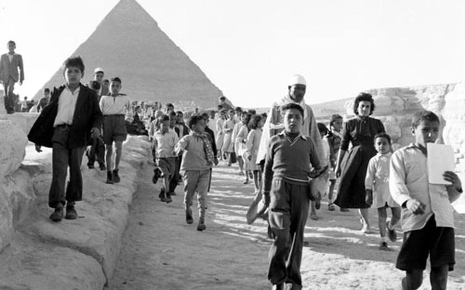Fortunate Egyptian schoolchildren take a field trip to one of the Seven Wonders of the Ancient World at Giza.