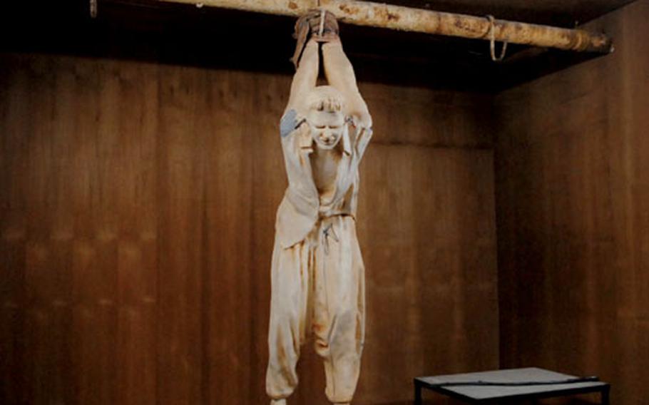 A plaster cast of a man being tortured is shown at the National Red Museum in Sulaymaniyah, Iraq. The wires represent electrodes hooked up to the man&#39;s ears.