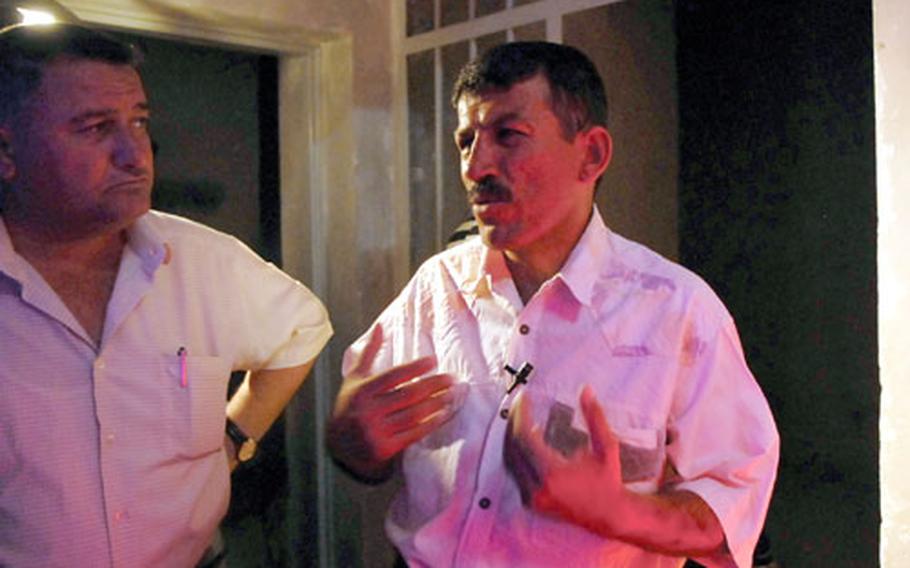 Shirwan Mahmoud, right, was imprisoned and tortured in the late 1980s at the Red Security compound in Sulaymaniyah, Iraq, which is now a museum. Mahmoud recently visited the museum and talked about what happened to him at the hands of Saddam Hussein&#39;s intelligence agents.