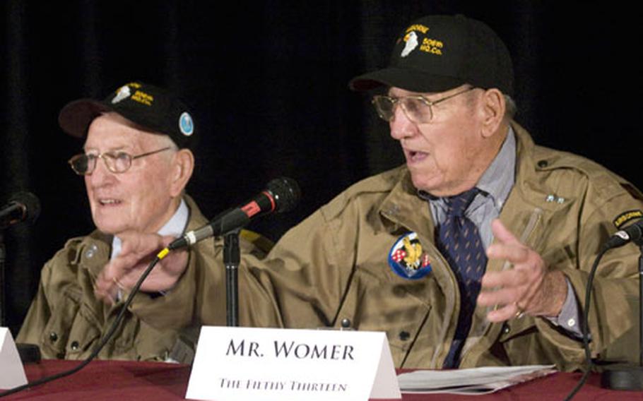 Robert Cone, left, listens as fellow "Filthy Thirteen" paratrooper Jack Womer talks about their World War II experiences.