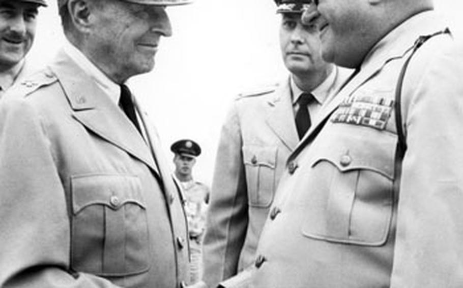 Among the famous people photographed by Sandy Colton during his time at Stripes was Gen. Douglas MacArthur, here being greeted at Yokota Air Base, Japan, in 1961.