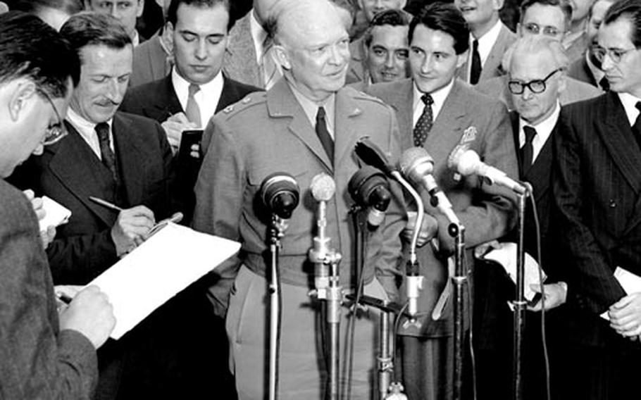 Gen. Eisenhower talks to reporters after his meeting with Chancellor Adenauer.